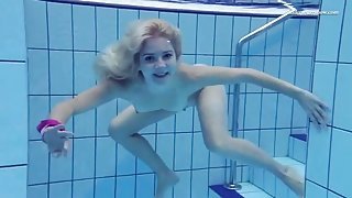 Bald pussy teen goes skinny dipping