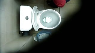 A hidden spy cam catches a chick pissing