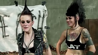 Tattooed lesbian punk bitches using strapons on each other