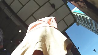 Woman upskirt public video shows her big ass in red thong