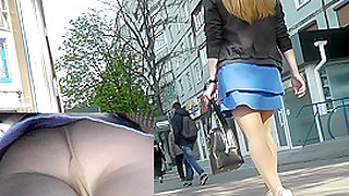 Upskirt voyeur video shows plump female in A-line skirt