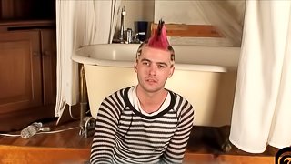 A gay punk masturbates his hard prick in a bathroom