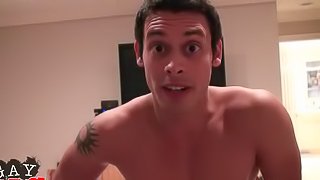 Dishy gay guy with short dark hair sucking a stranger's cock and balls